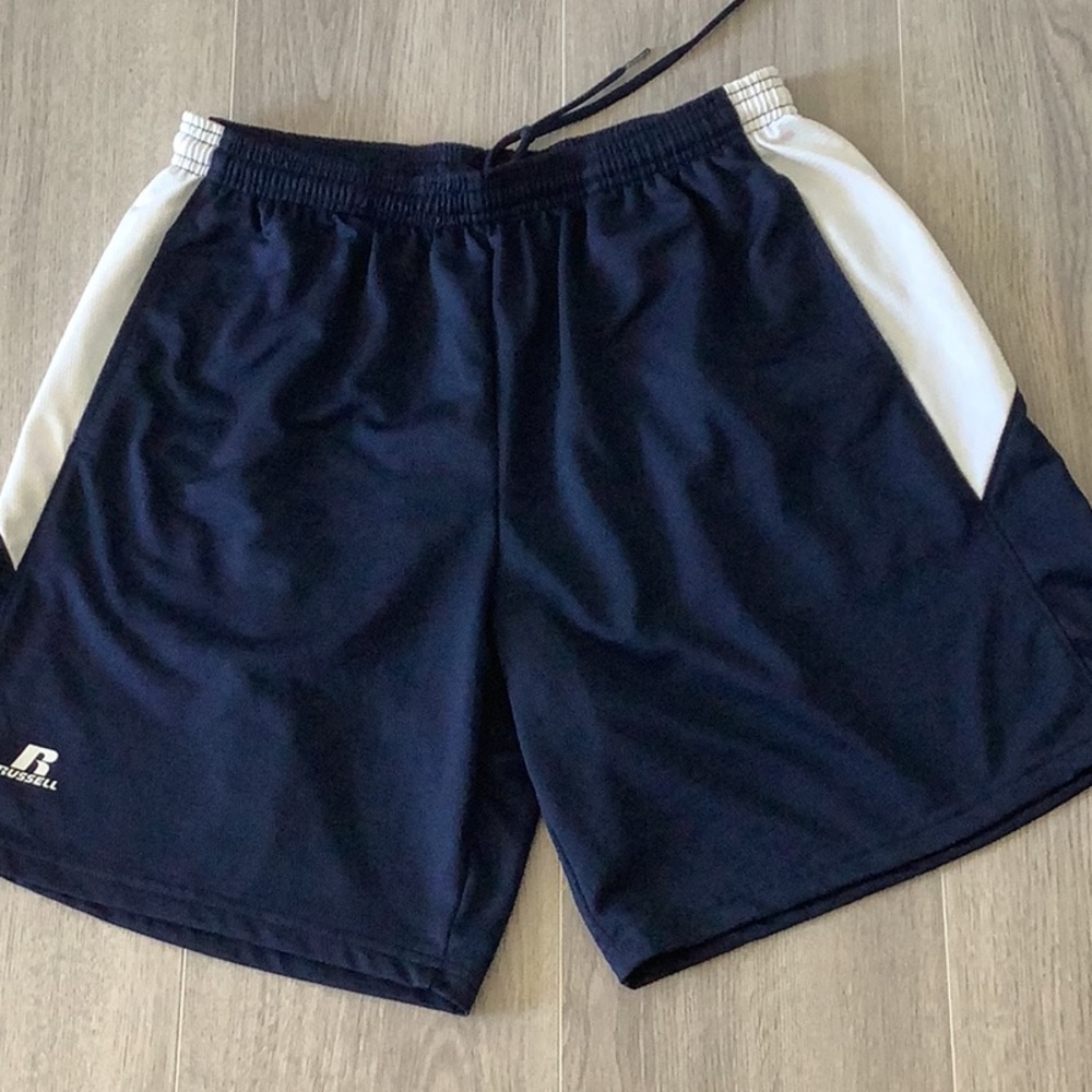 Men dry performance athletic shorts by RUSSELL in size M. In navy. 7.5” inseams